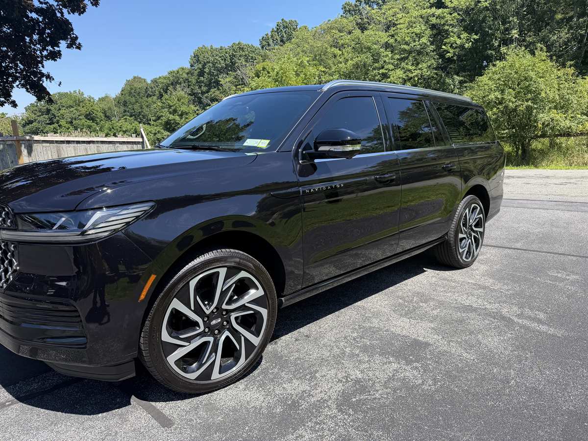 Black Lincoln Navigator SUV, front three-quarter view — Orange County Limousine, Newburgh NY