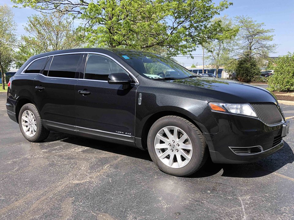 Black Lincoln MKT Town Car sedan, front three-quarter view — Orange County Limousine, Newburgh NY