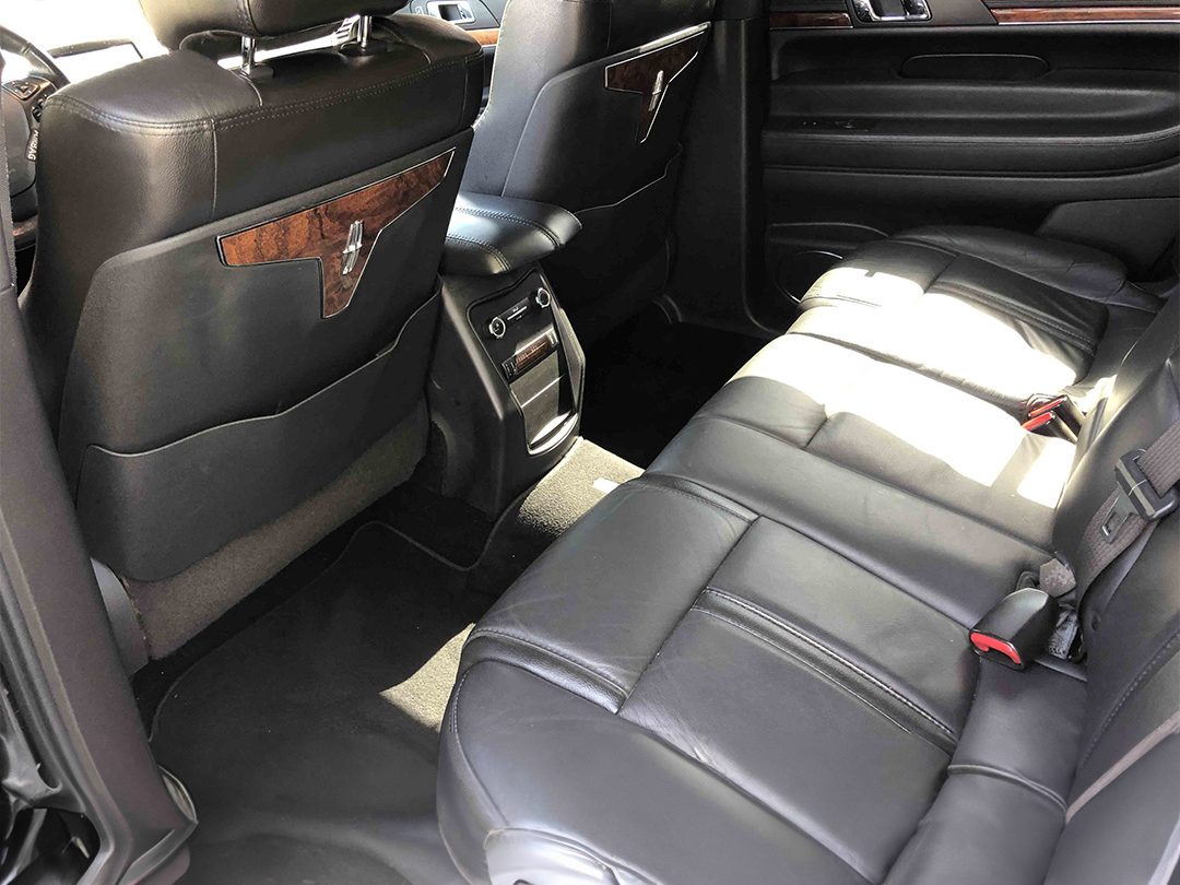 Black leather rear passenger seating inside the Lincoln MKT sedan
