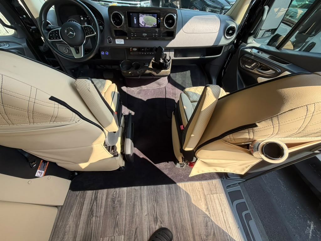Forward cabin and wood flooring inside the Mercedes-Benz Sprinter executive coach