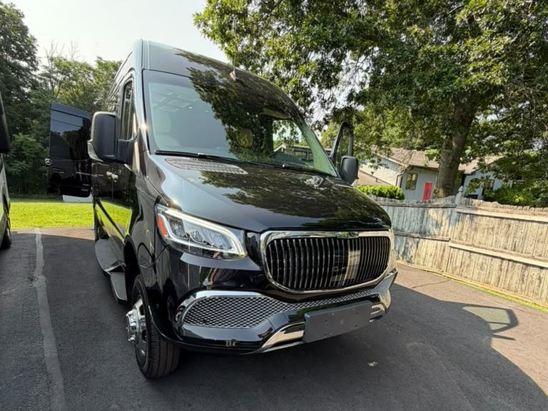 Black Mercedes-Benz Sprinter executive coach, front three-quarter view — Orange County Limousine, Newburgh NY